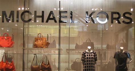 when did michael kors become public|Michael Kors llc.